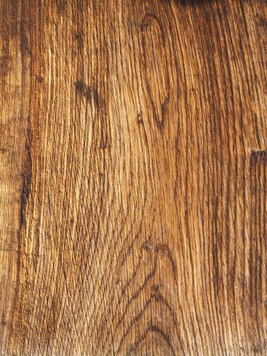A vertical shot of a wooden surface under the lights - cool for backgrounds