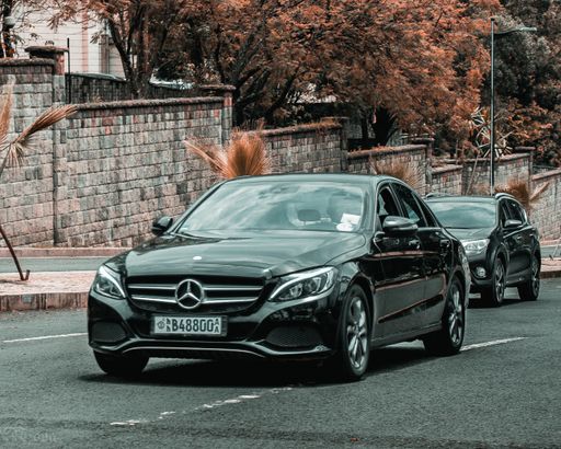 The luxury Mercedes Benz C class black car in the street of Addis Ababa in Ethiopia