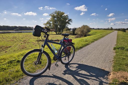 Lenzen, Germany, October 7 2021, bicycle on dyke on the elbe bike lane in background the german river elbe, it is also the iron curtain trail