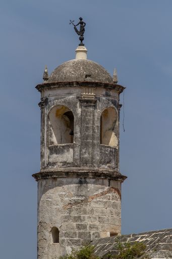 A vertical shot of the Giraldilla de la Habana on the tower of the Castillo de la Real Fuerza, Cuba.