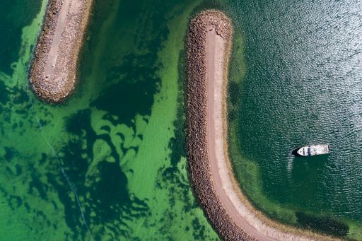 A top view of a solitary boat moored in the marina at Whyalla in South Australia