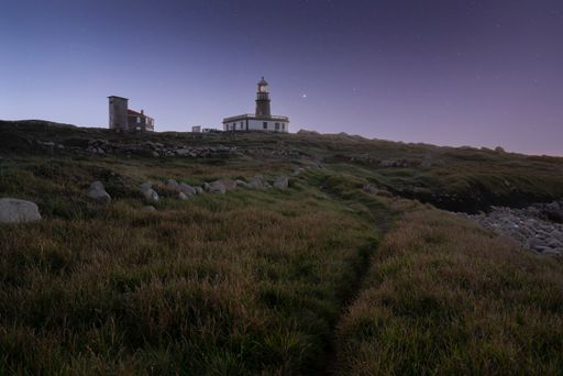 The Corrubedo lighthouse on a gloomy evening in Galicia, Spain