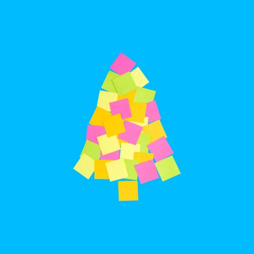 Colorful square paper notes which depict the Christmas tree concept  isolated on a blue background