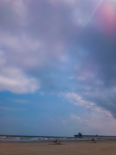 A vertical shot of a beach during sunset in Charleston, South Carolina, USA