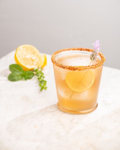 A vertical shot of a glass of refreshing drink with a slice of lemon