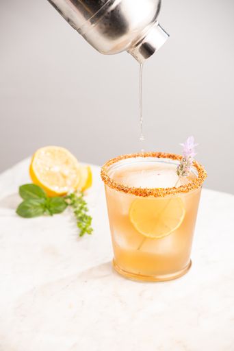 A vertical shot of a glass of refreshing drink with a slice of lemon