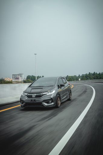 A vertical shot of Honda Jazz at Pantai Indah Kapuk Jakarta, Indonesia