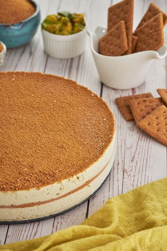 A vertical shot of no-bake triple chocolate mousse cake, and other ingredients