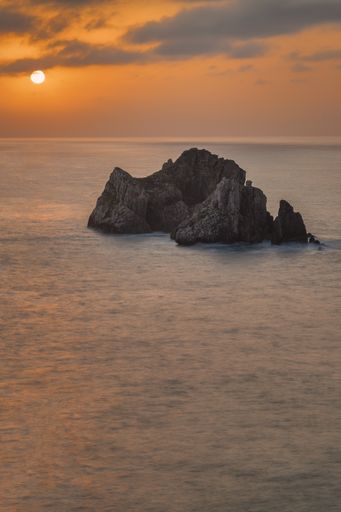 A vertical shot of a beautiful Costa Quebrada during the sunset in Spain