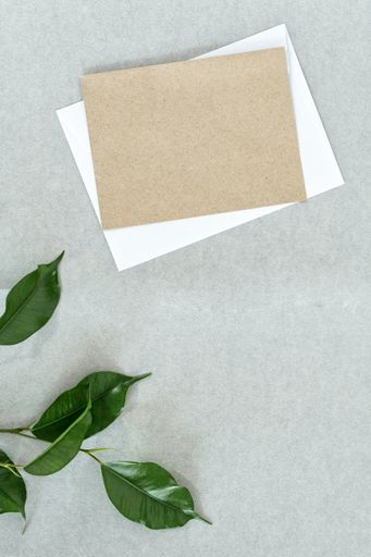 An empty invitation or greeting card mockup on a gray background