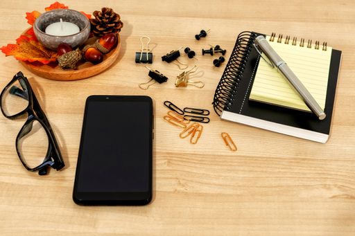 A closeup of various working objects on a wooden surface