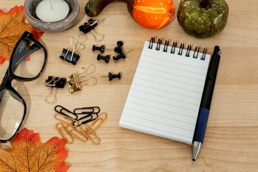 A closeup of various working objects on a wooden surface