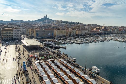 An aerial shot of Marseille old Port and Notre Dame de la Garde basilica, France