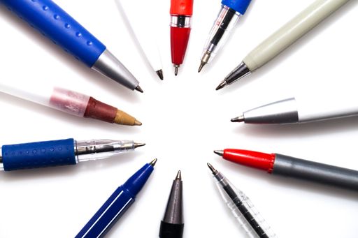 Many different pens isolated on a white background with a copy space