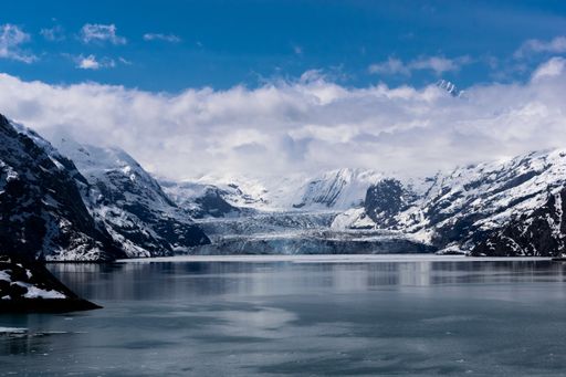 A beautiful scenery of a lake and mountains covered with snow in Alaska, USA