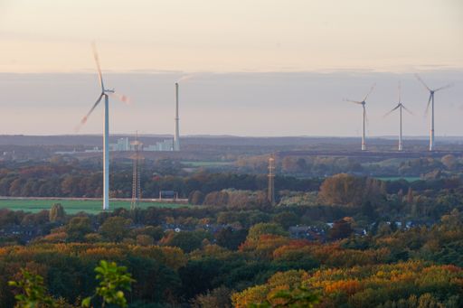 A countryside scene with wind turbines