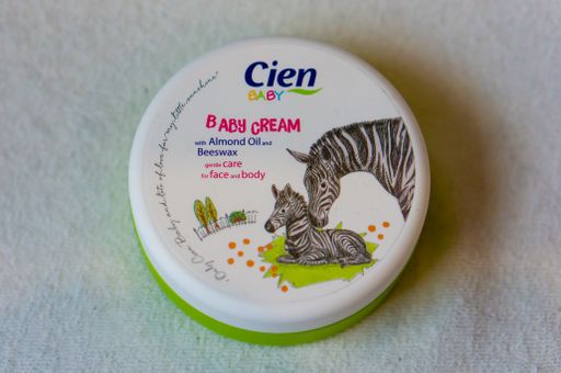 A close up shot of the Cien brand Baby Cream almond oil in a container, Poznan, Poland
