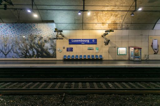 An inside view of an underground metro station in Paris without people