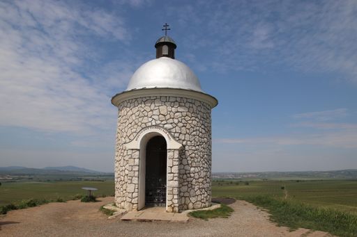 A famous little stony chapel at the top of the hill with blue sky above at Velke Bilovice, South Moravia, Czech republic