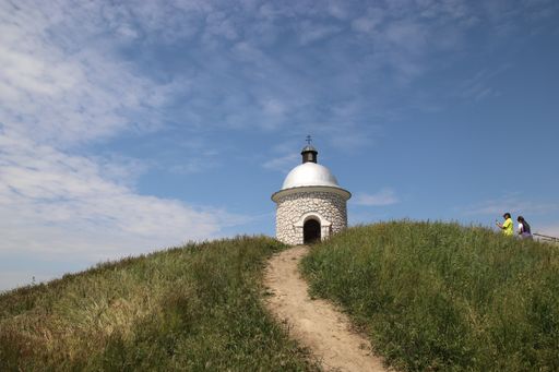 A famous little stony chapel at the top of the hill with blue sky above at Velke Bilovice, South Moravia, Czech republic