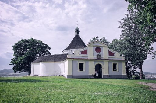 A view to a Chapel of the Exaltation of the Holy Cross at the top of the hill above Cesky Krumlov, Czech republic