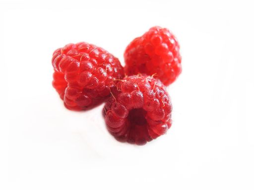 A closeup shot of raspberry isolated on white background