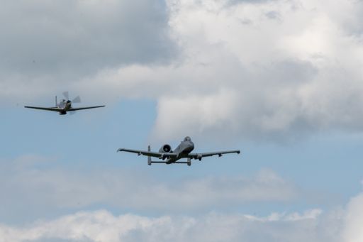 A group of flying aircraft against a cloudy sky during the National Air Show in Cleveland, USA