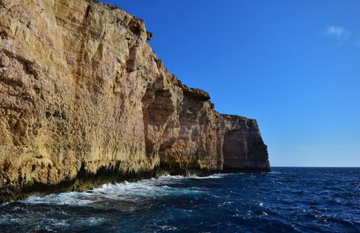 A beautiful shot of coralline limestone sea cliffs in Migra il-Ferha, Maltese Islands, Malta on a sunny day