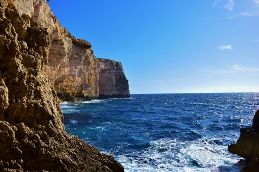 A beautiful shot of coralline limestone sea cliffs in Migra il-Ferha, Dingli Cliffs, Maltese Islands, Malta on a sunny day