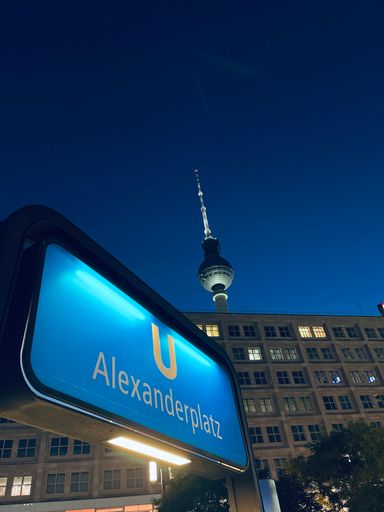 A vertical closeup of a blue sign in the streets at Berlin Germany