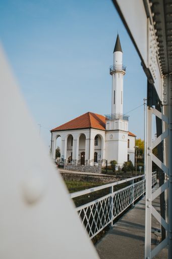 A vertical shot of a church under the clear skies