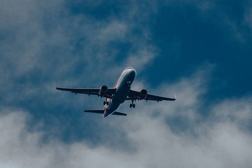 A low angle shot of an airplane in the sky