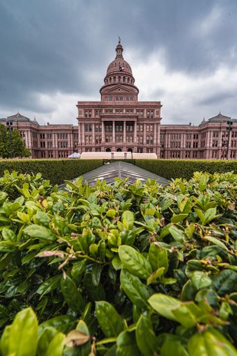 A vertical shot of the Texas State Capitol in Austin, USA