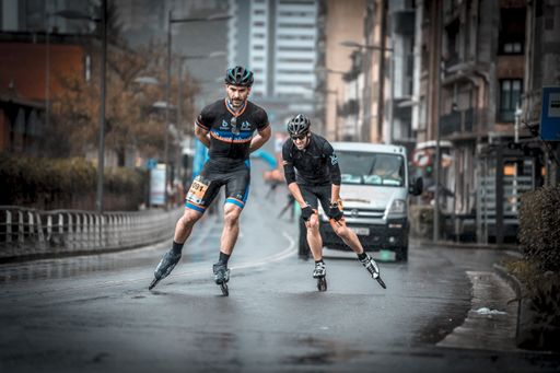 Rollers contesting a race in the rain. Behobia San Sebastian race in 2019 at kilometer 12 of 20. Spain