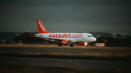 An EasyJet airplane a320 taking off at sunset in John Lennon Airport, Liverpool, United Kingdom
