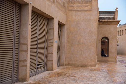 A stone house with parking garages in Dubai, UAE