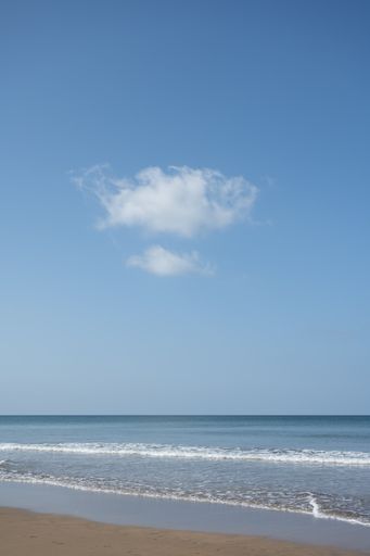 The beautiful beach against a cloudy blue sky at Sandymouth, Bude Cornwall, UK