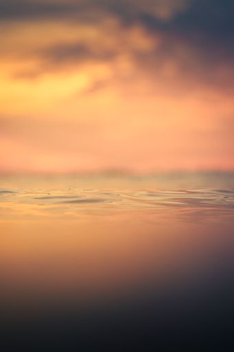 A vertical shot of the beautiful sunset above the sea. Domburg, Zeeland, the Netherlands.