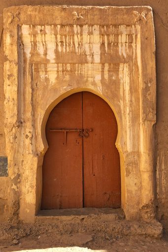 A vertical shot of a vintage door in Merzouga, Morocco
