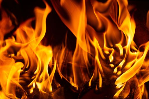 A closeup shot of the bright flames of the bonfire