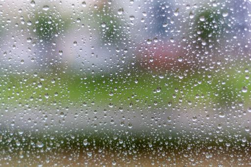 The drops of water on a glass in a rainy day