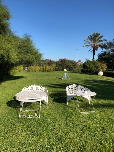 The tables and chairs in the hotel garden in Catania, Sicily, Italy