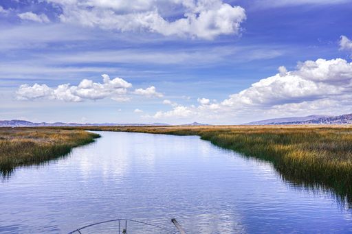 A breathtaking shot of Titicaca lake under the cloudy skies in Peru