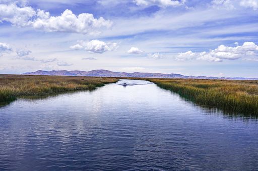 A breathtaking shot of Titicaca lake under the cloudy skies in Peru