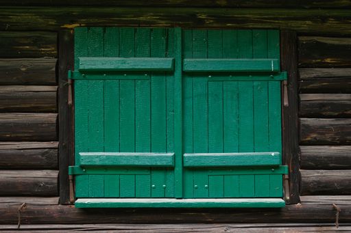 Close-up view of windows on a forest hut