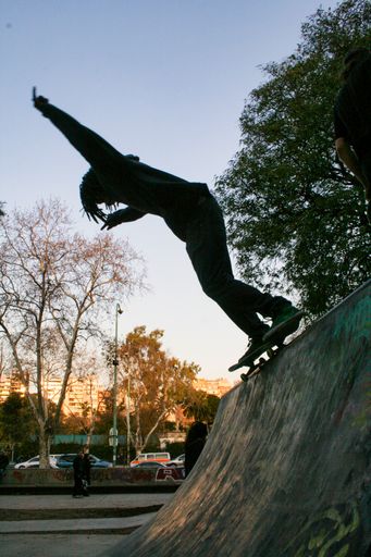 A vertical shot of a skateboarder performing stunts in Buenos Aires, Argentina