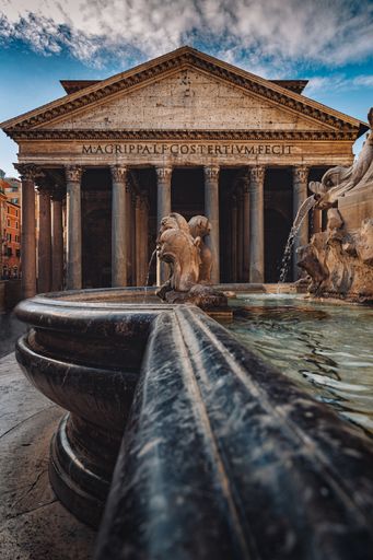 A scenic shot of the historically famous Pantheon under the cloudy sky in Rome, Italy