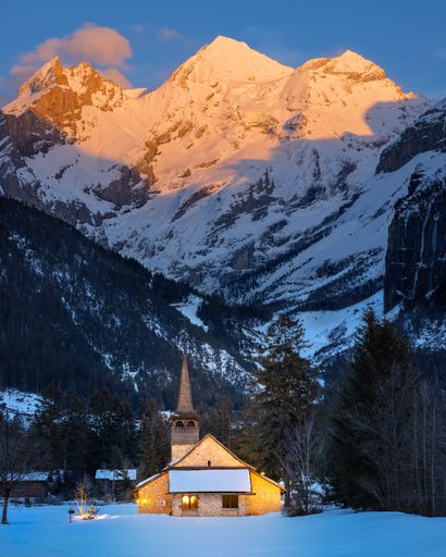 A castle in a mountainous region on the sunrise