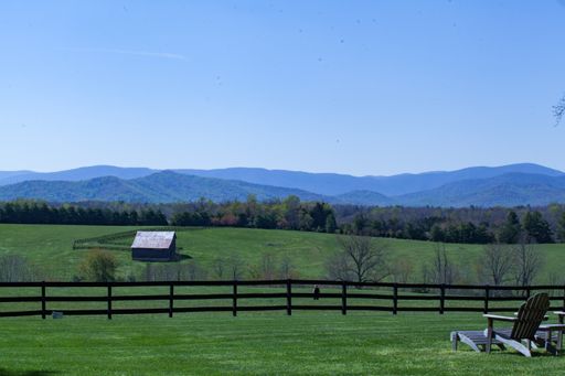 A wonderful view of the village with a field on a sunny day