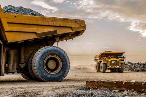 A dump trucks transporting Platinum ore for processing